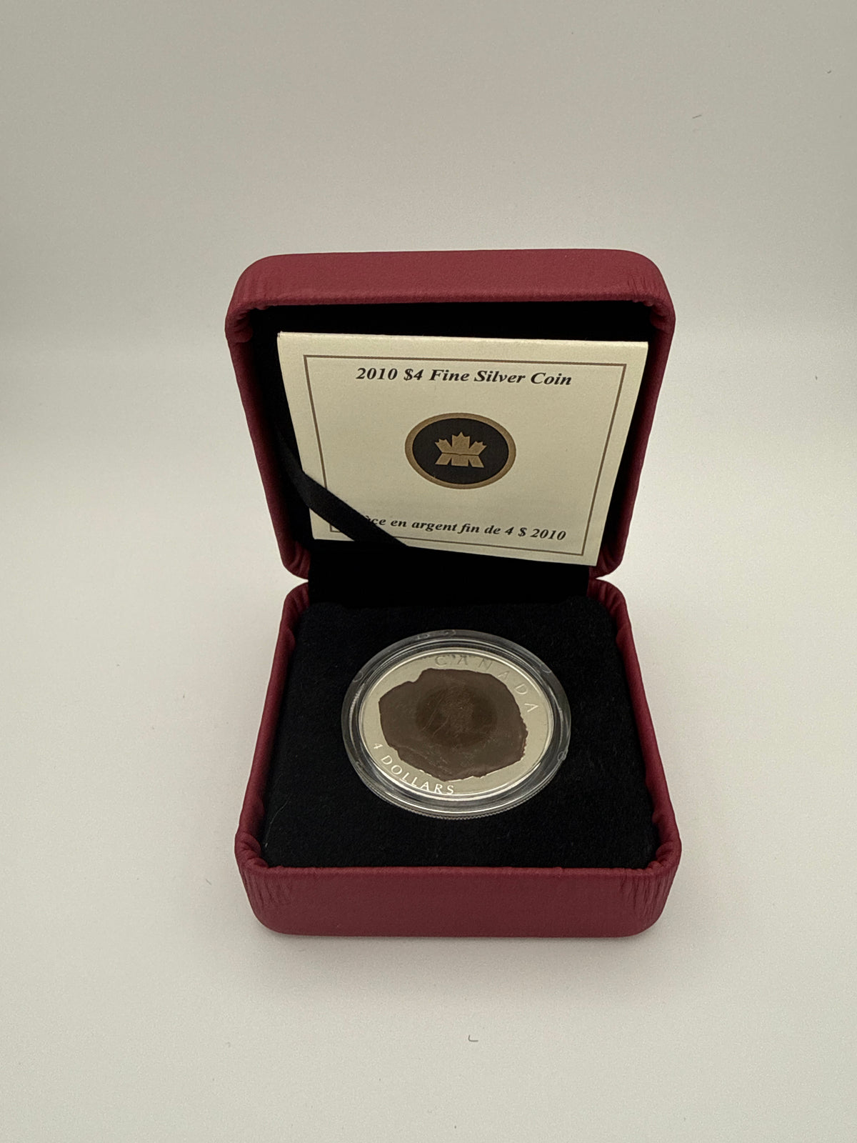 2010 Canada $4 fine silver Dinosaur Collection coin, Dromaeosaurus fossil design