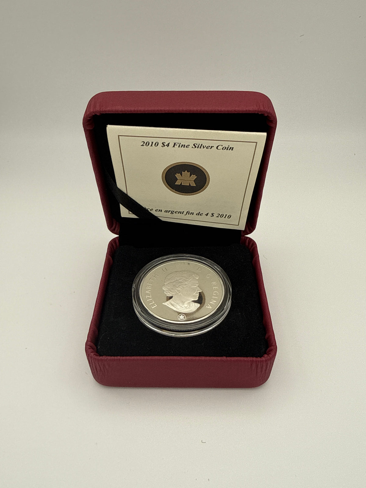2010 Canada $4 fine silver Dinosaur Collection coin, Dromaeosaurus fossil design (view 3)